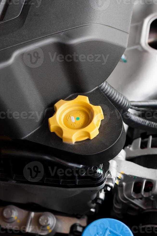 engine oil cap in car hood photo