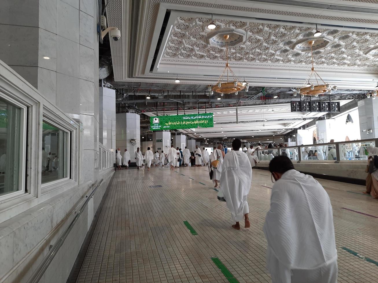 Mecca, Saudi Arabia, May 2022 - Umrah pilgrims are going for a Sai between Safa and Marwah after circumambulating the Kaaba. photo