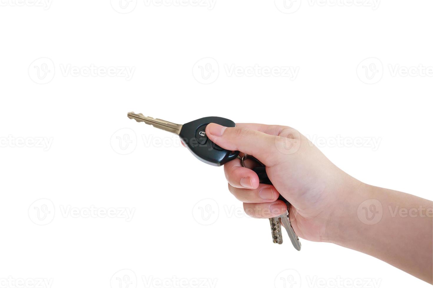 women's hand presses on the remote control car alarm systems photo