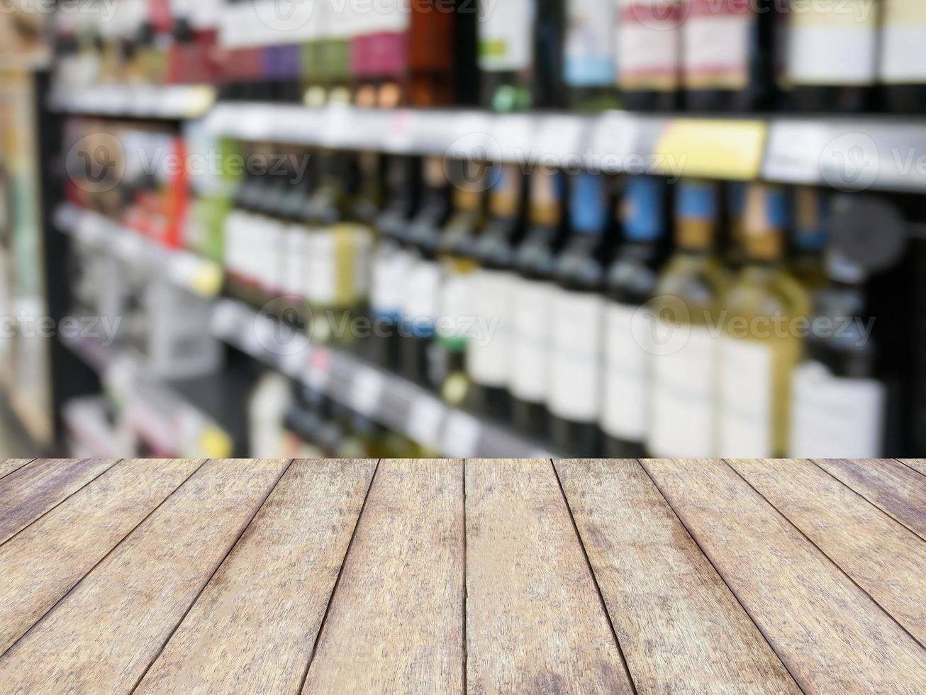 Wine bottles on shelf in wine store photo