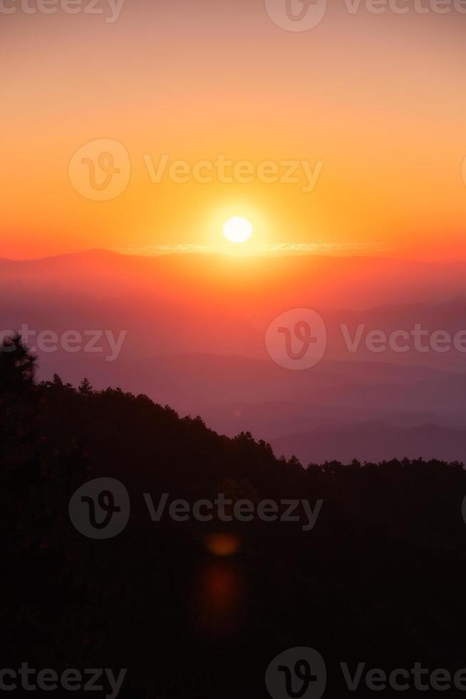 Sunrise over mountain with colorful sky in tropical rainforest at national park in the morning photo