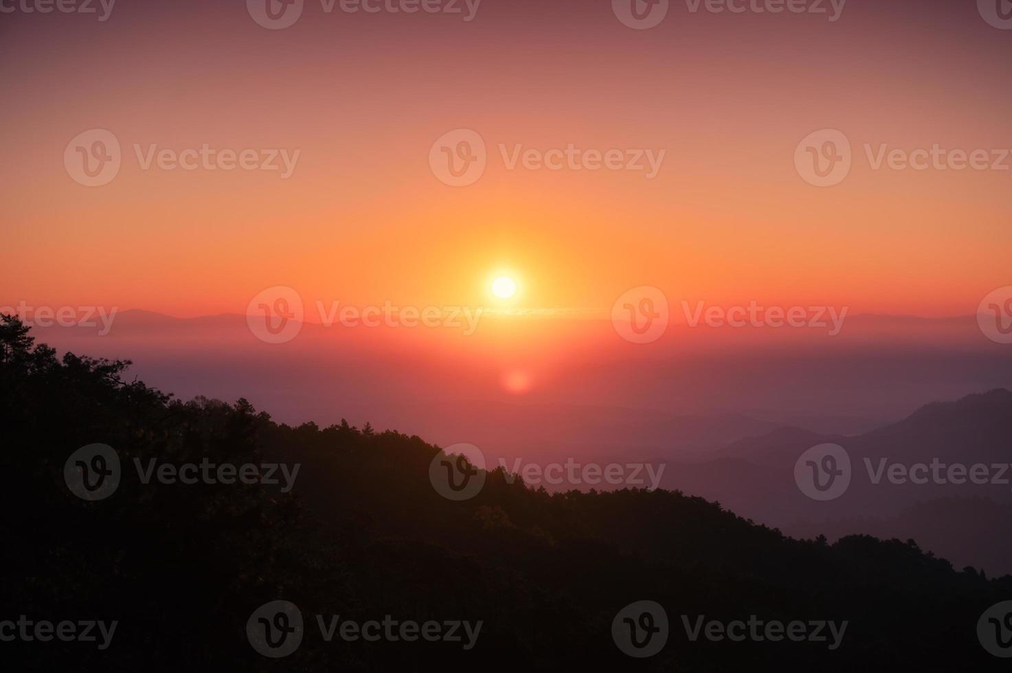 Sunrise over mountain with colorful sky in tropical rainforest at national park in the morning photo