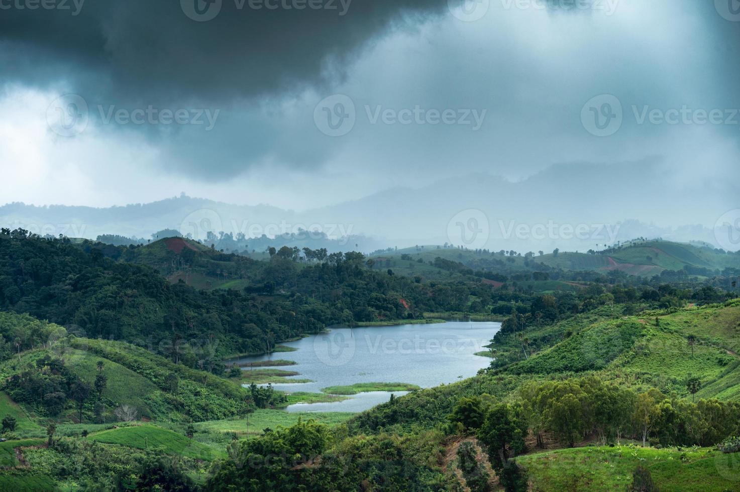 Rainstorm on mountain and lake in rainforest at national park photo