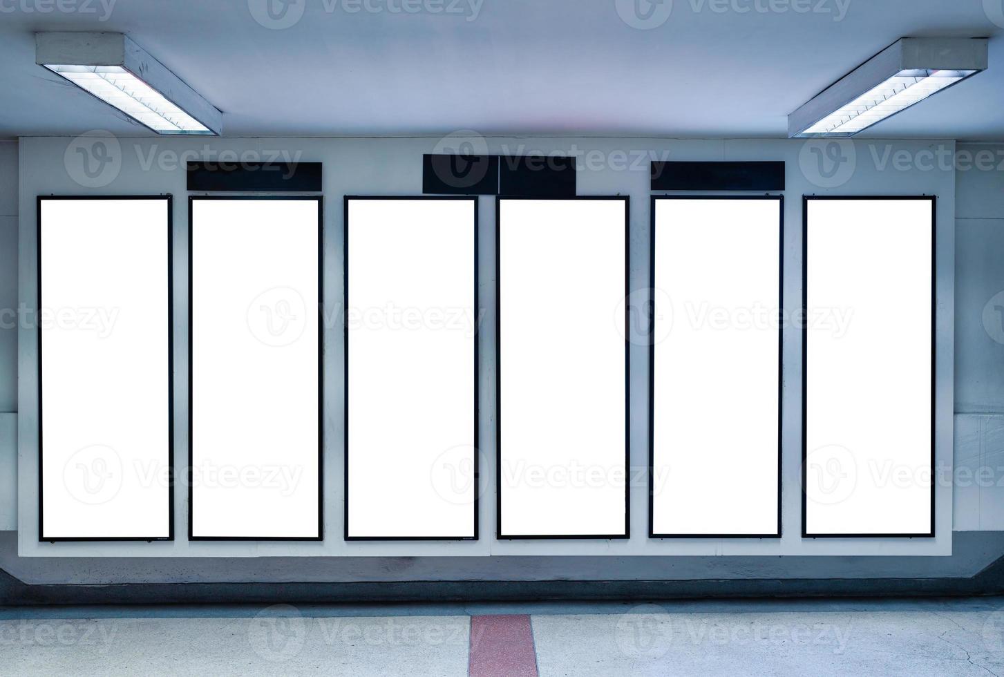 Row of empty digital vertical billboard on wall photo