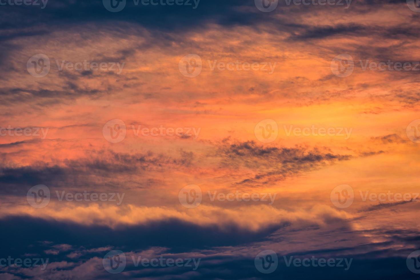 Beautiful dramatic sky and clouds in the sunset photo