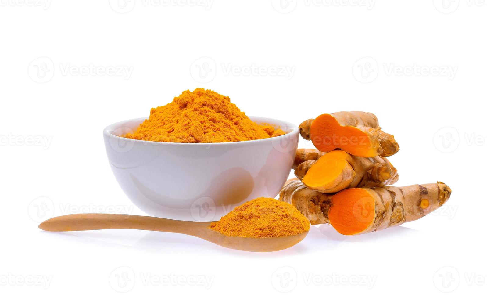 Turmeric roots and turmeric powder on white background photo