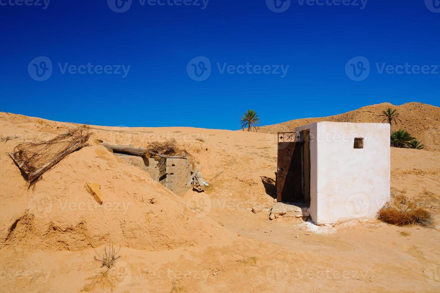 White building in Sahara desert, Tunisia, North Africa photo