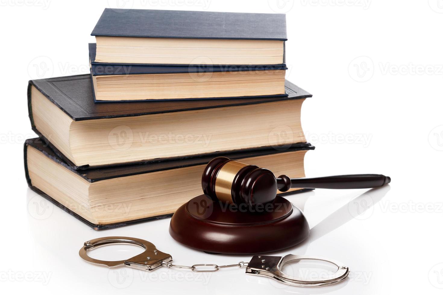 Gavel, books and handcuffs photo