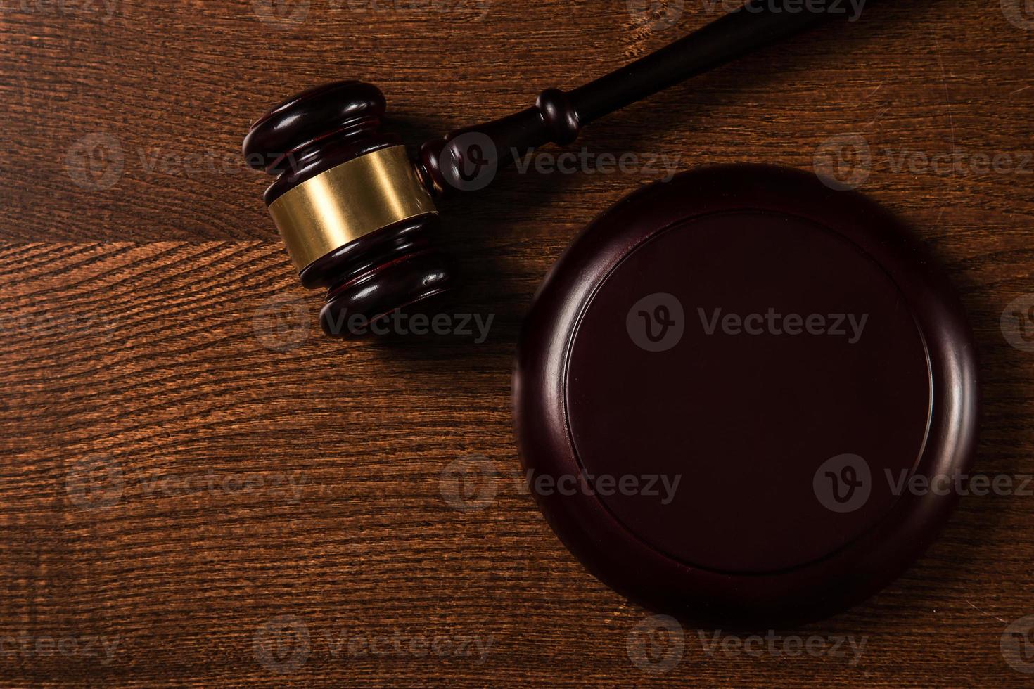 Judge hammer on wooden background photo