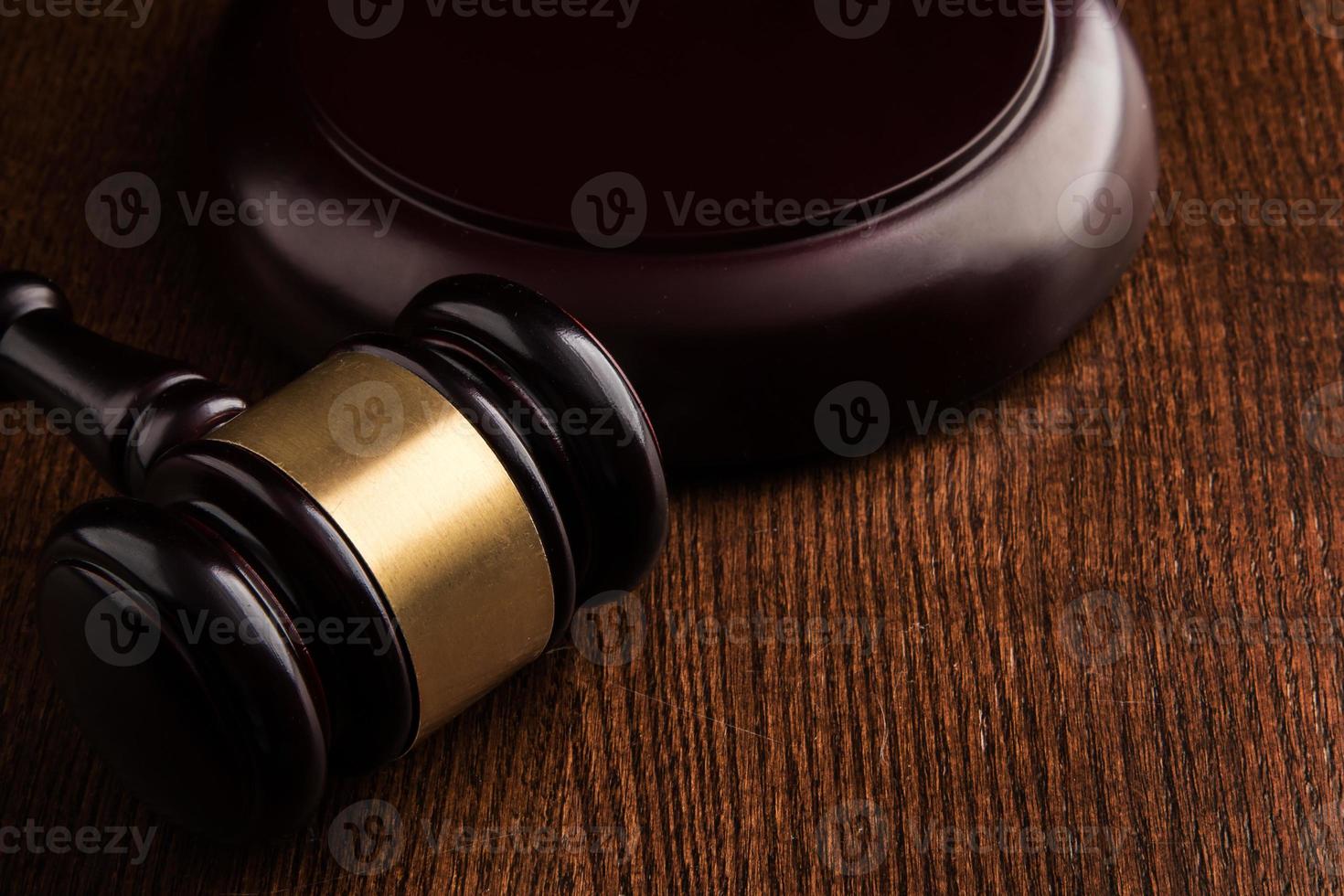 Judge hammer on wooden background photo