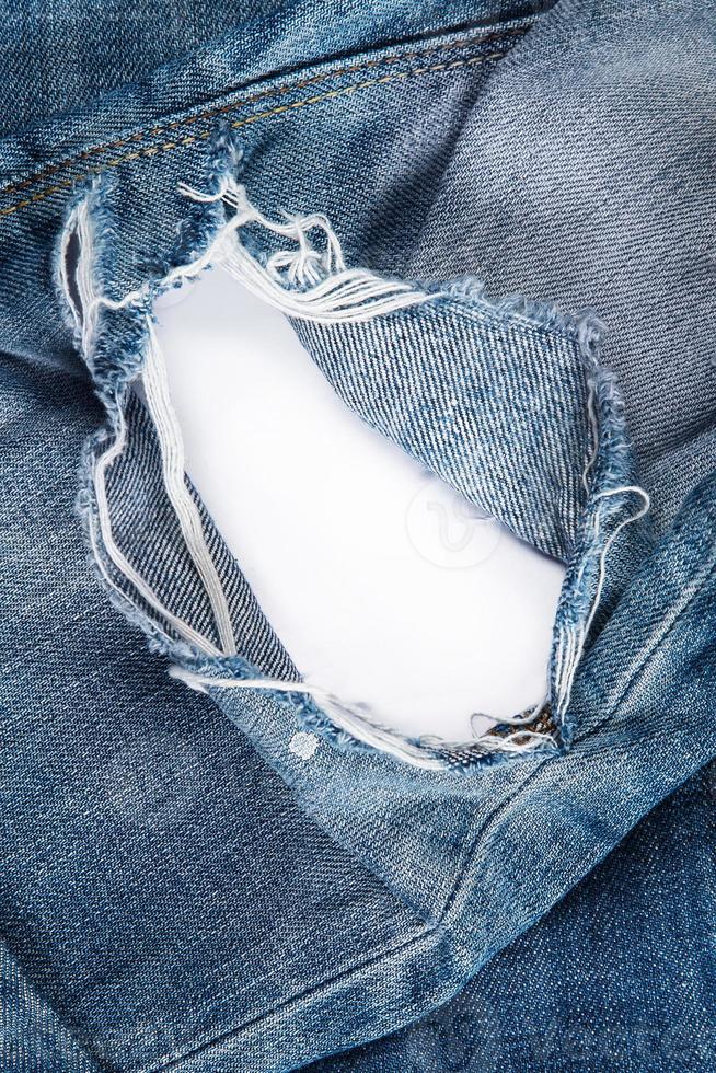 Jeans texutre with a hole photo