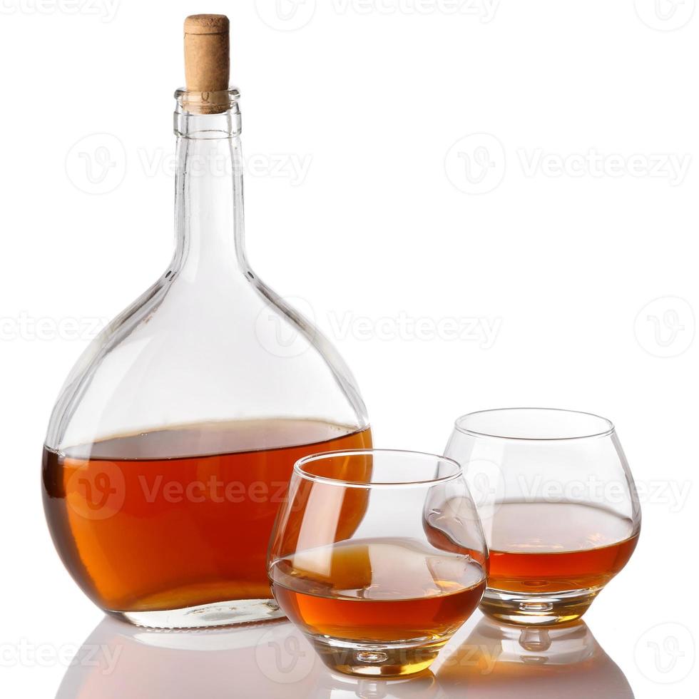 Bottle and glasses with cognac photo