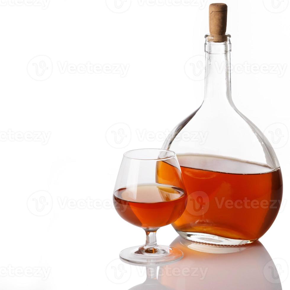 Bottle and glass with cognac photo