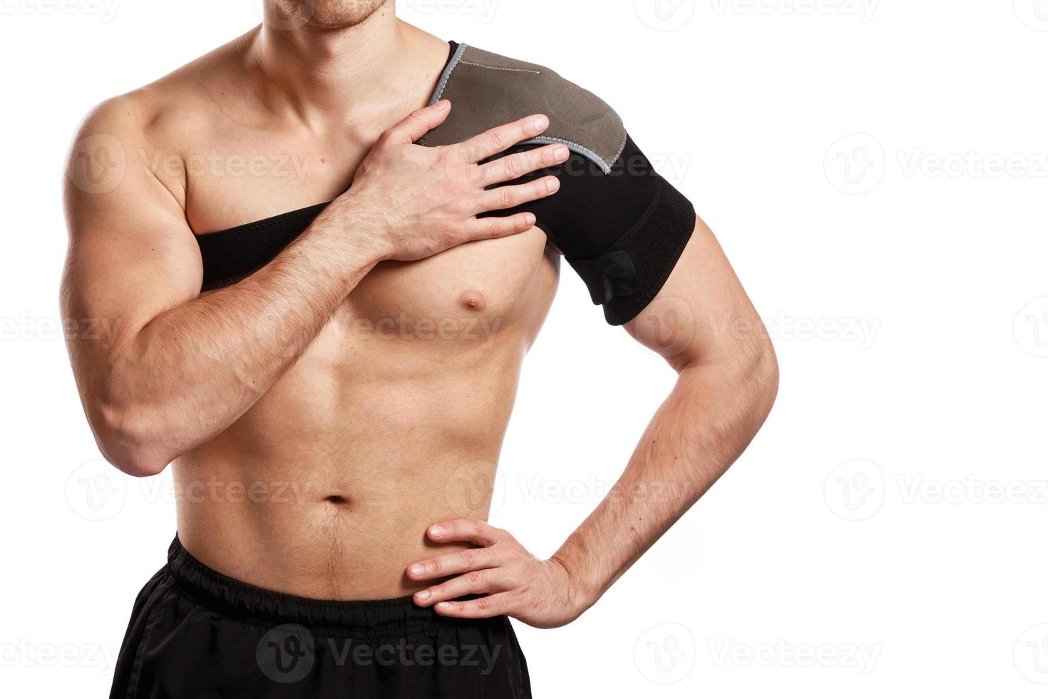 Sportsman with a support bandage on his shoulder photo