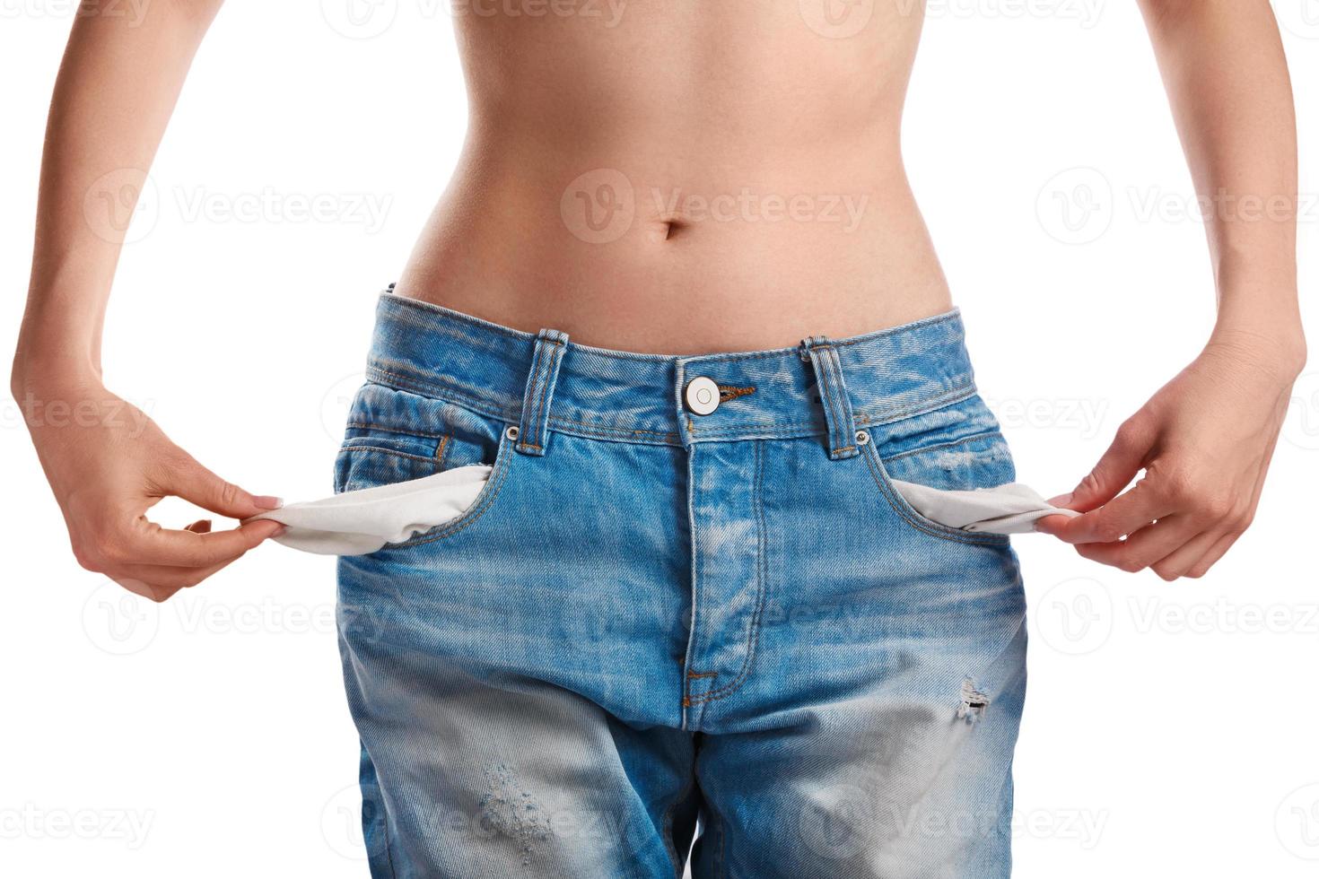 Woman showing her empty pockets photo
