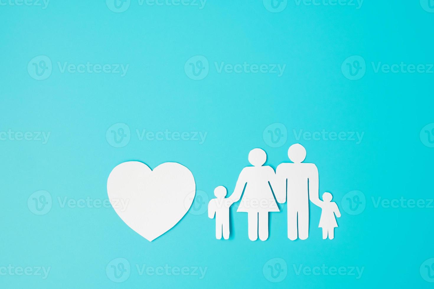 Happy Family day. paper shape cutout with Father, Mother, Children and heart. international day of families, Warm home, love, Foster, Insurance, Charity and Donation concepts. photo