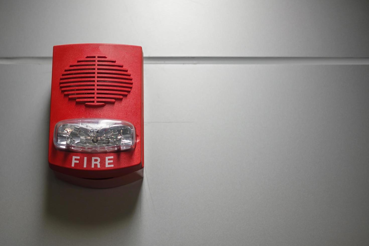 Fire alarm switch on the wall, powerful emergency equipment for industrial and residential photo