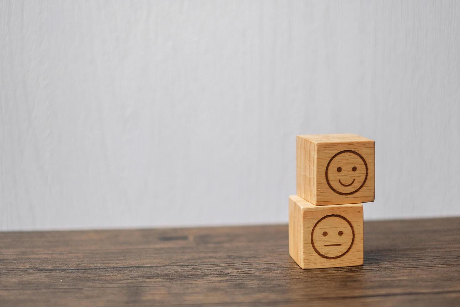 emotion face symbol on wooden blocks. mood, Service rating, ranking, customer review, satisfaction, evaluation and feedback concept photo