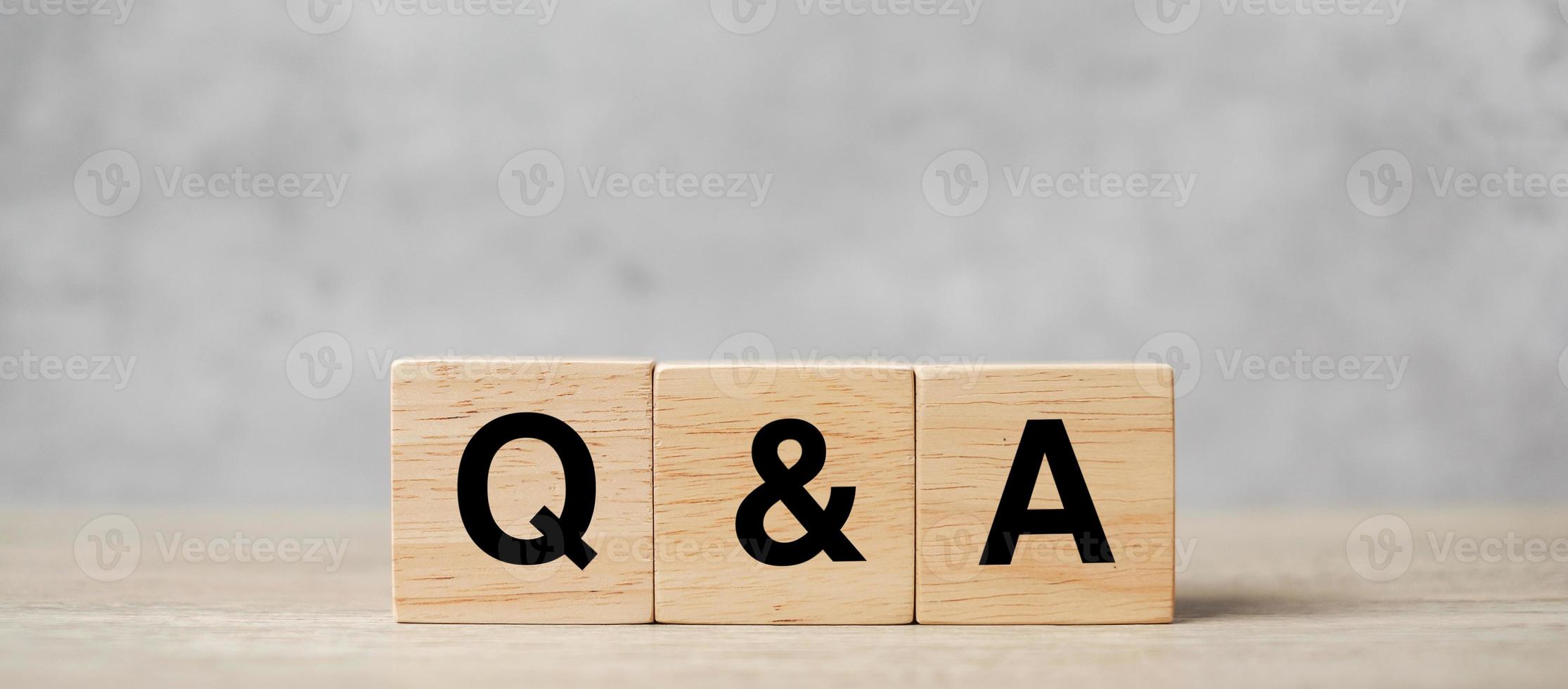 Q and A word with wooden block. FAQ  frequency asked questions, Answer, Question  Ask, Information, Communication and Brainstorming Concepts photo