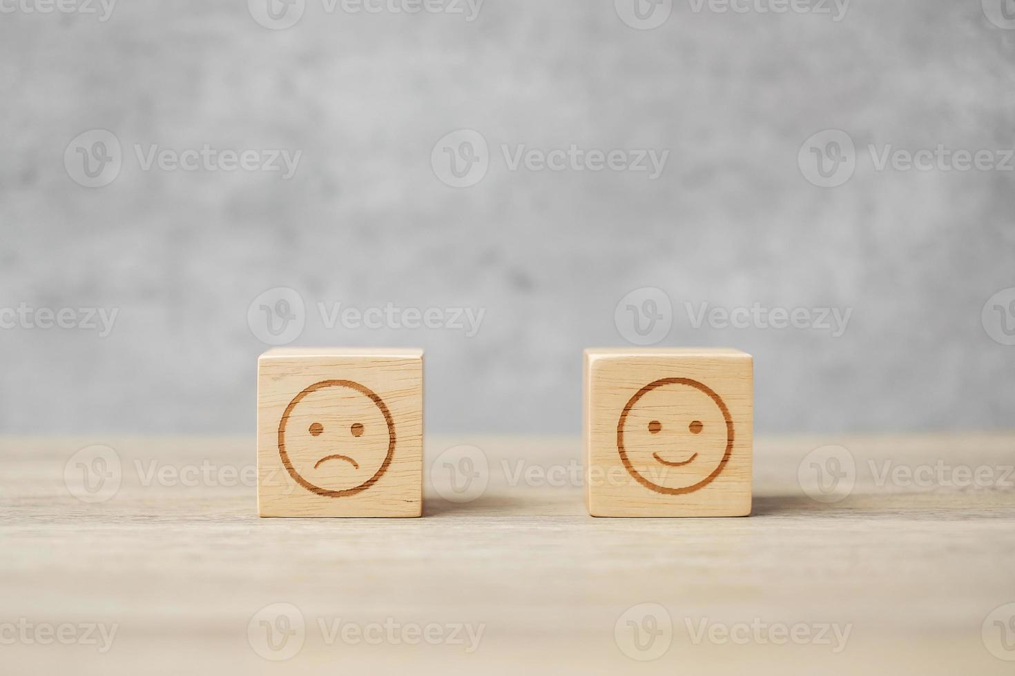emotion face symbol on wooden blocks. mood, Service rating, ranking, customer review, satisfaction, evaluation and feedback concept photo