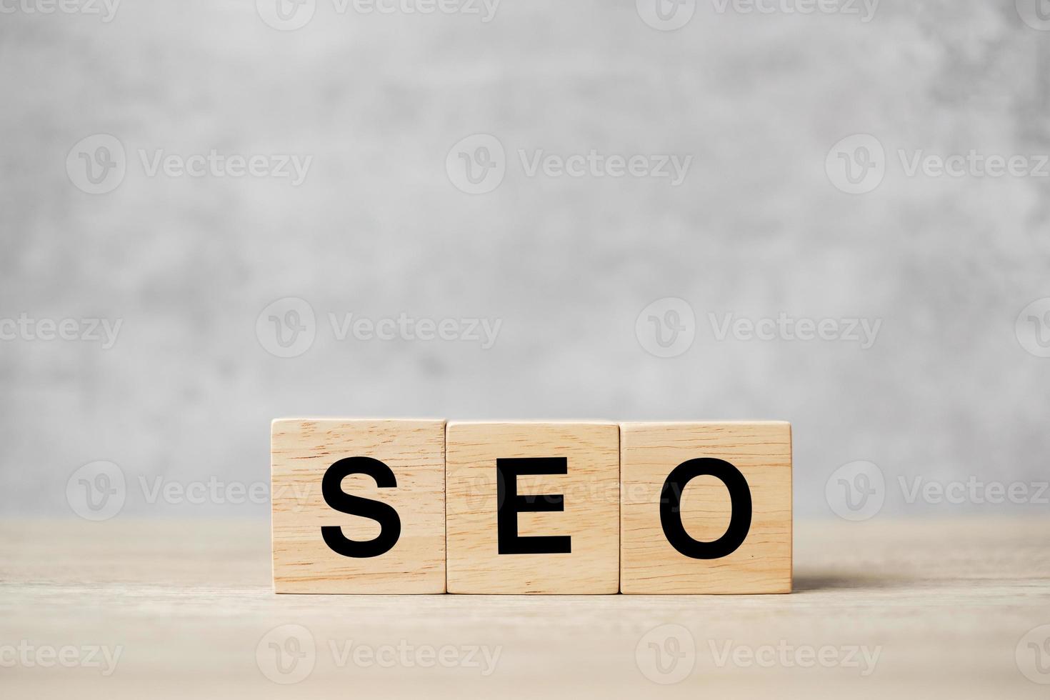 SEO Search Engine Optimization text wooden cube blocks on table background. Idea, Strategy, advertising, marketing, Keyword and Content concept photo