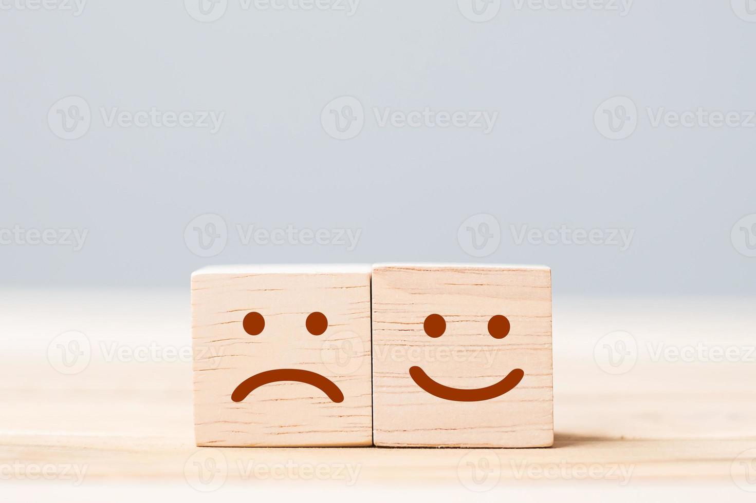 emotion face symbol on wooden cube blocks. Service rating, ranking, customer review, satisfaction and feedback concept photo