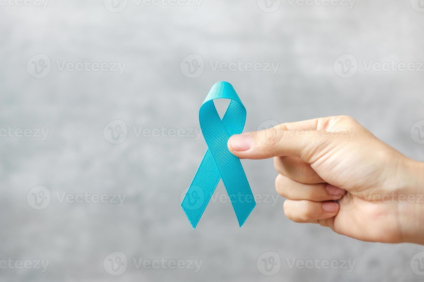 November Prostate Cancer Awareness month, man holding light Blue Ribbon for supporting people living and illness. Healthcare, International men, Father, World cancer day and world diabetes day concept photo