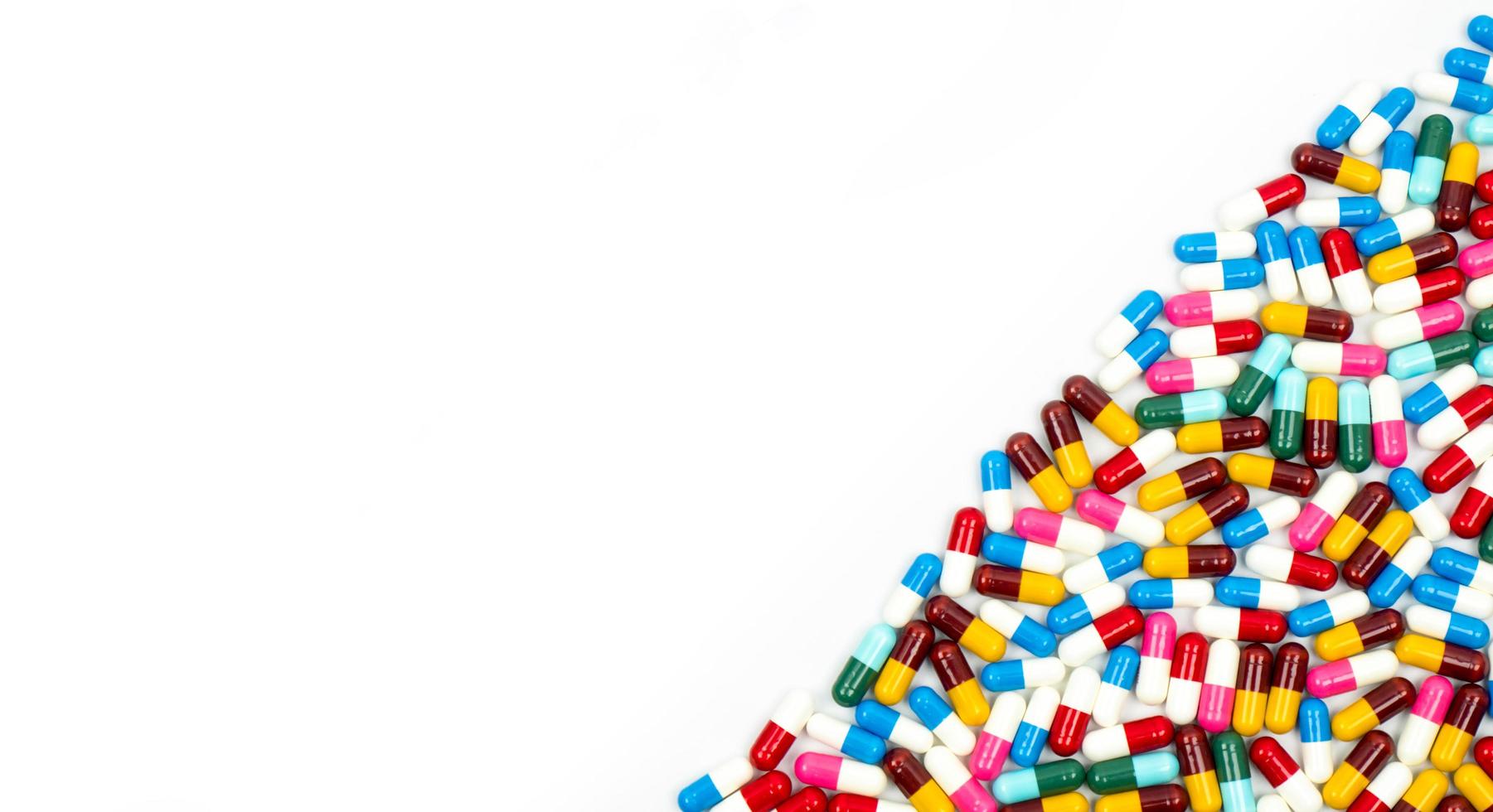 Colorful of antibiotic capsules pills isolated on white background with copy space. Drug resistance concept. Antibiotics drug use with reasonable and global healthcare concept. photo