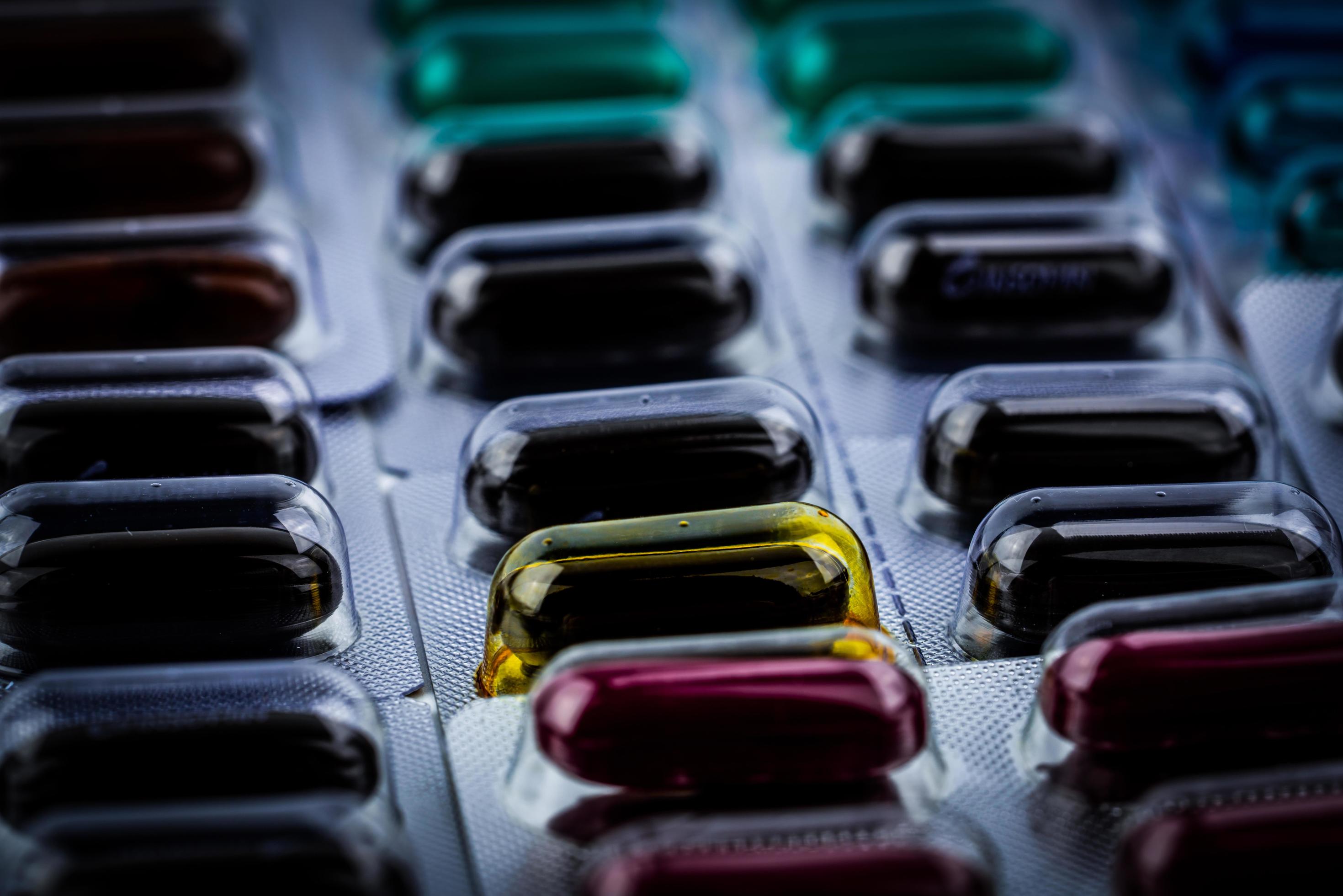 Selective focus expired capsule pill with physical change. Defective