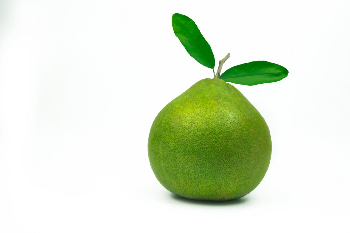 Red pomelo with leaves isolated on white background with clipping path. Thailand Siam ruby pomelo fruit. Natural source of vitamin C antioxidants and potassium. Healthy food for slow down aging photo