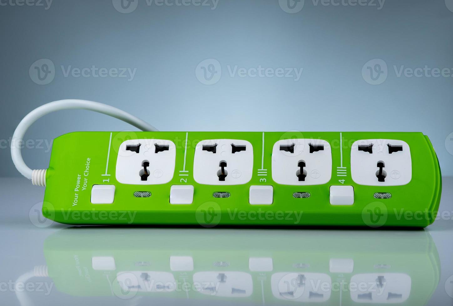 High quality and safety power strip with four electrical standard socket. Green universal plug with overload protection. Fire resistant material for cover. Circuit breaker. Individual switch. photo