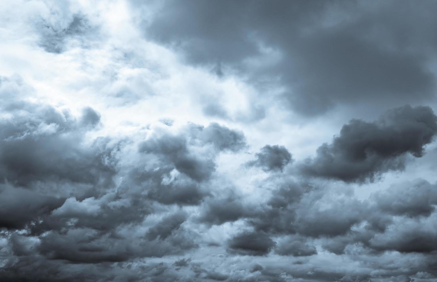 Dark dramatic sky and clouds. Background for death and sad concept. Gray sky and fluffy white clouds. Thunder and storm sky. Sad and moody sky. Nature background. Dead abstract background. Cloudscape. photo