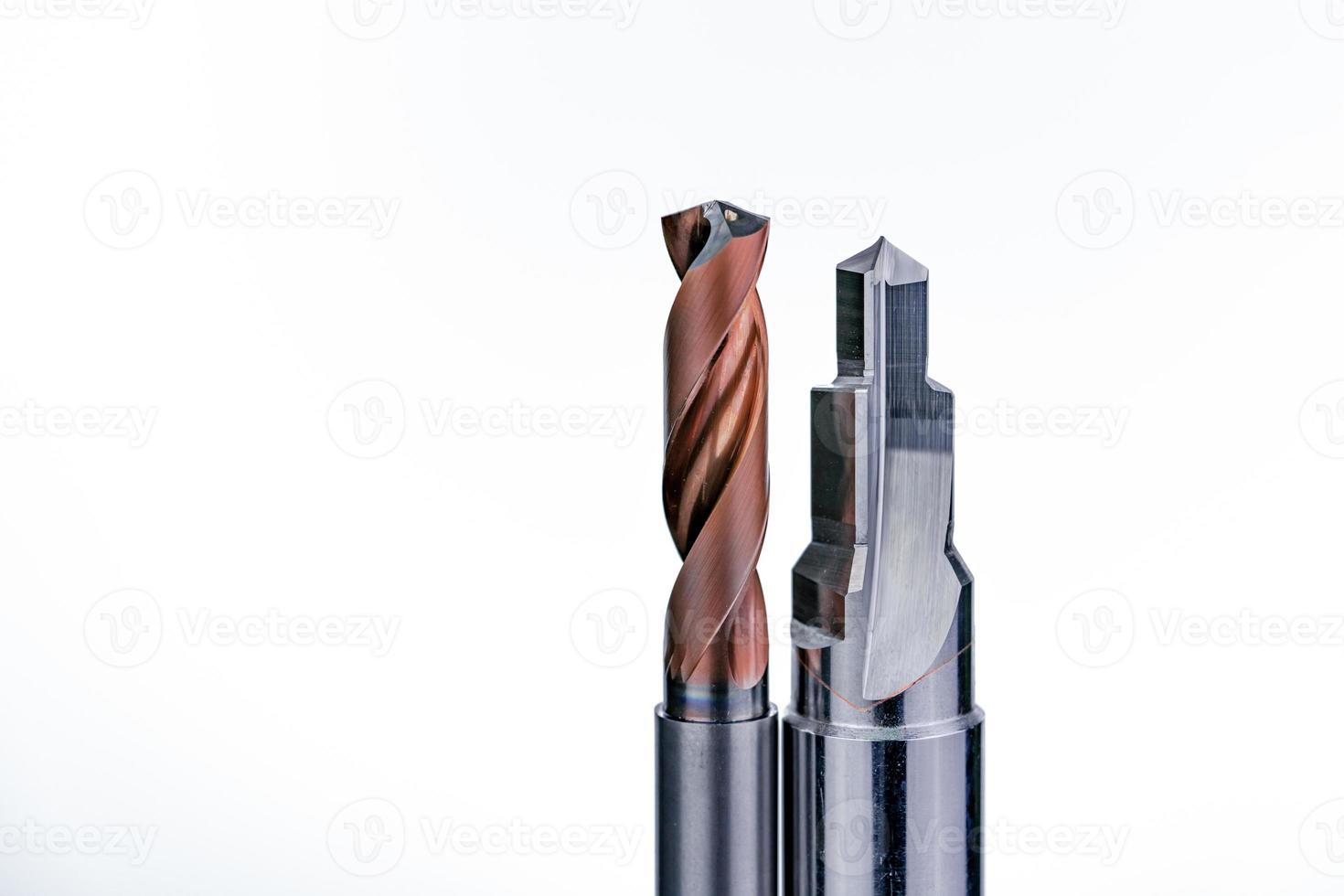 Special tools isolated on white background. Coated step drill and reamer detail. HSS cemented carbide. Carbide cutting tool for industrial applications. Engineering tools. Made to order special tools. photo