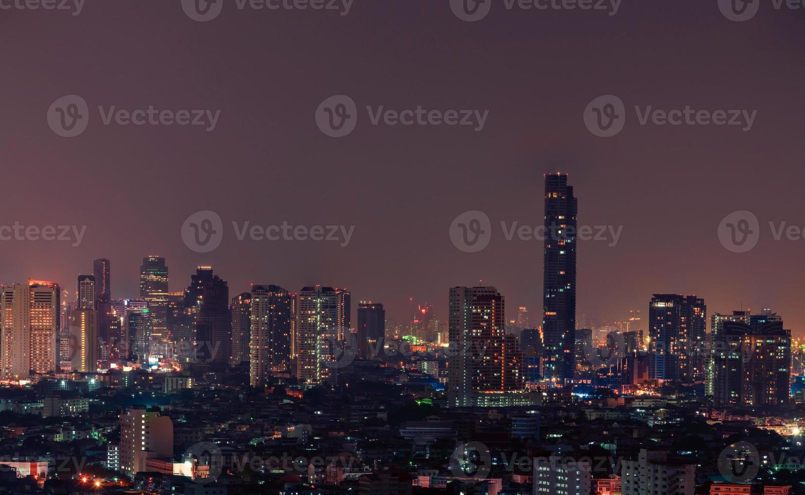 Cityscape of modern building in the night. Modern architecture office building. Skyscraper with beautiful evening sky. Business and financial center building. Apartment in the city with night light. photo