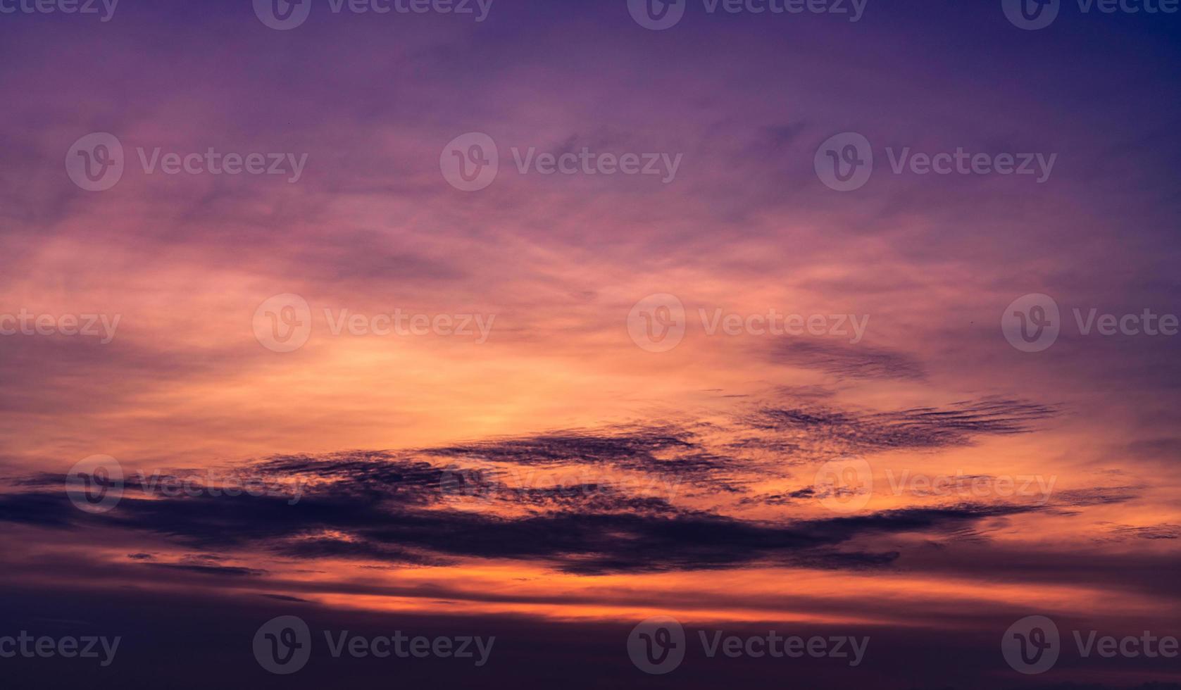 Beautiful sunset sky. Purple sky at sunset. Art picture of sky and dark clouds at dusk. Peaceful and tranquil concept. Twilight sky in evening. Background for life quote. Purple, red, and dark clouds. photo