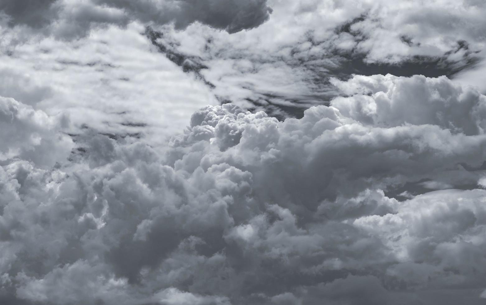 Dark dramatic sky and clouds. Background for death and sad concept. Gray sky and fluffy white clouds. Thunder and storm sky. Sad and moody sky. Nature background. Dead abstract background. Cloudscape. photo