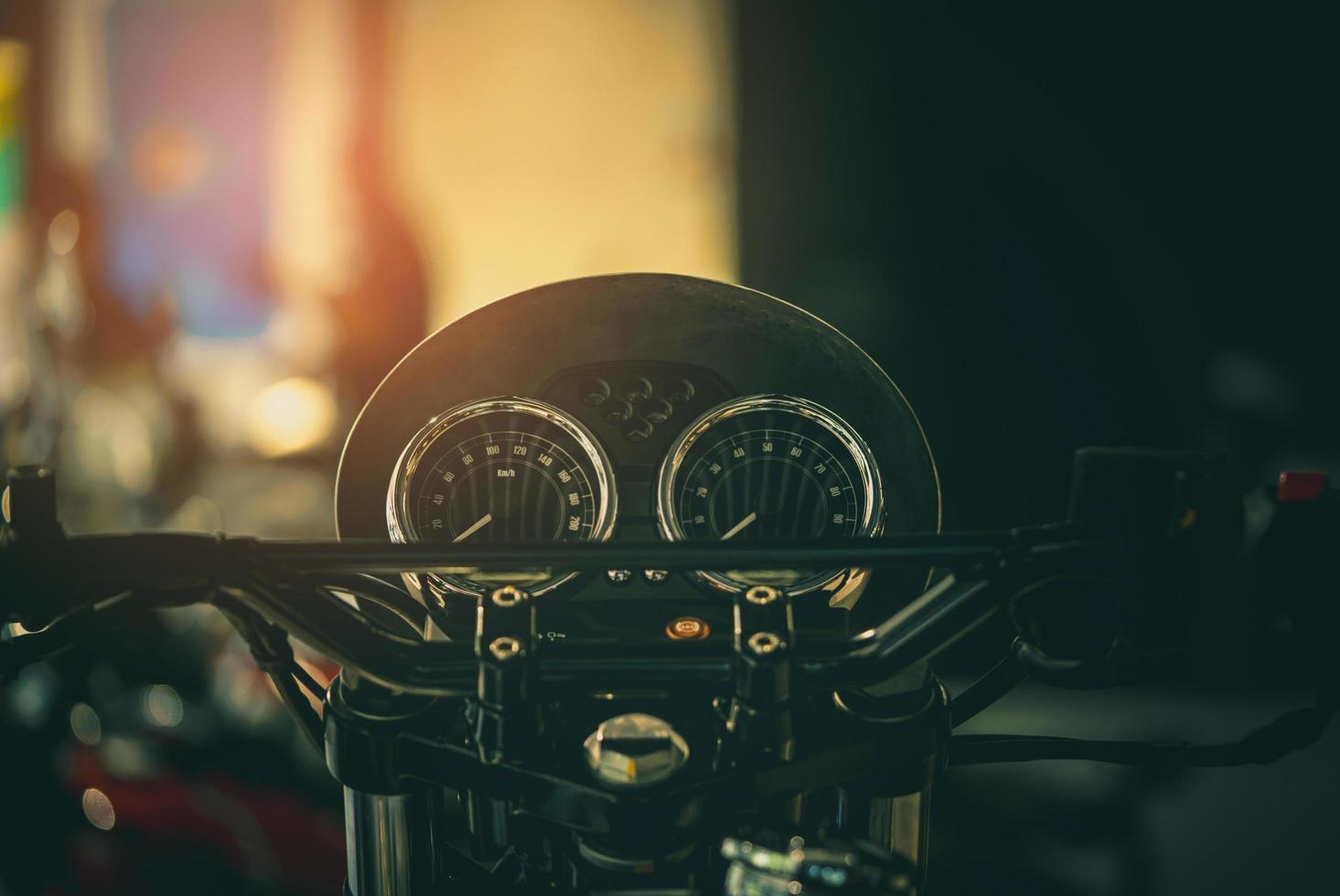 Black screen display of motorcycle miles. Vintage style motorcycle. Tachometer and speed gauges of motorcycle. Speedometer photo