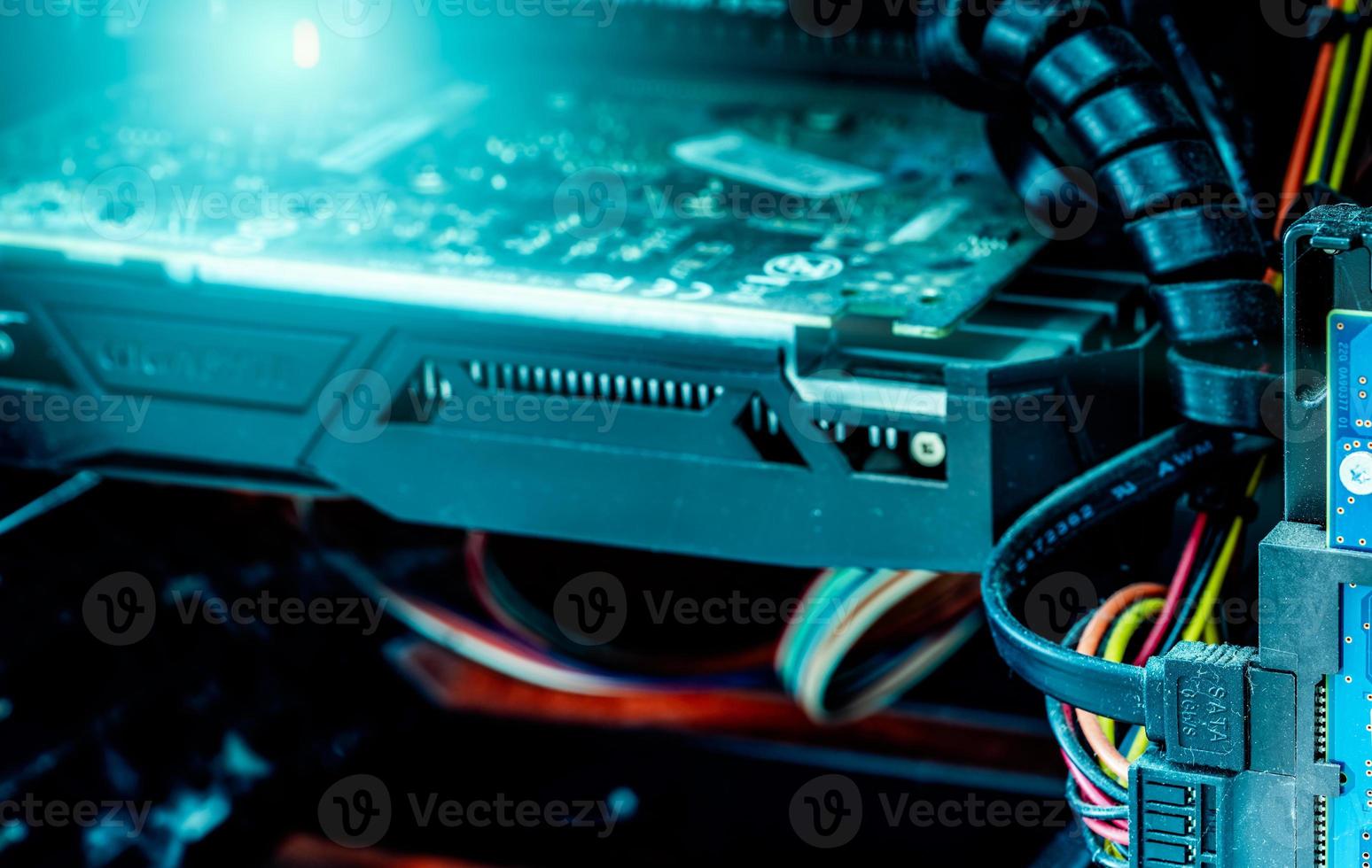 Computer hardware. Inside of PC plenty of dust need to clean. Dirty hardware. The cable transmits the data from the hard disk to the computer's processing system. Computer technology concept. photo