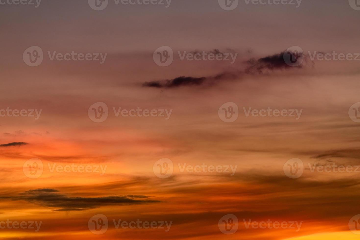 Beautiful sunset sky. Golden sunset sky. Orange, yellow, and red clouds in the evening. Freedom and calm background. Beauty in nature at tropical climate. Peaceful and spiritual scene. Romantic sky. photo