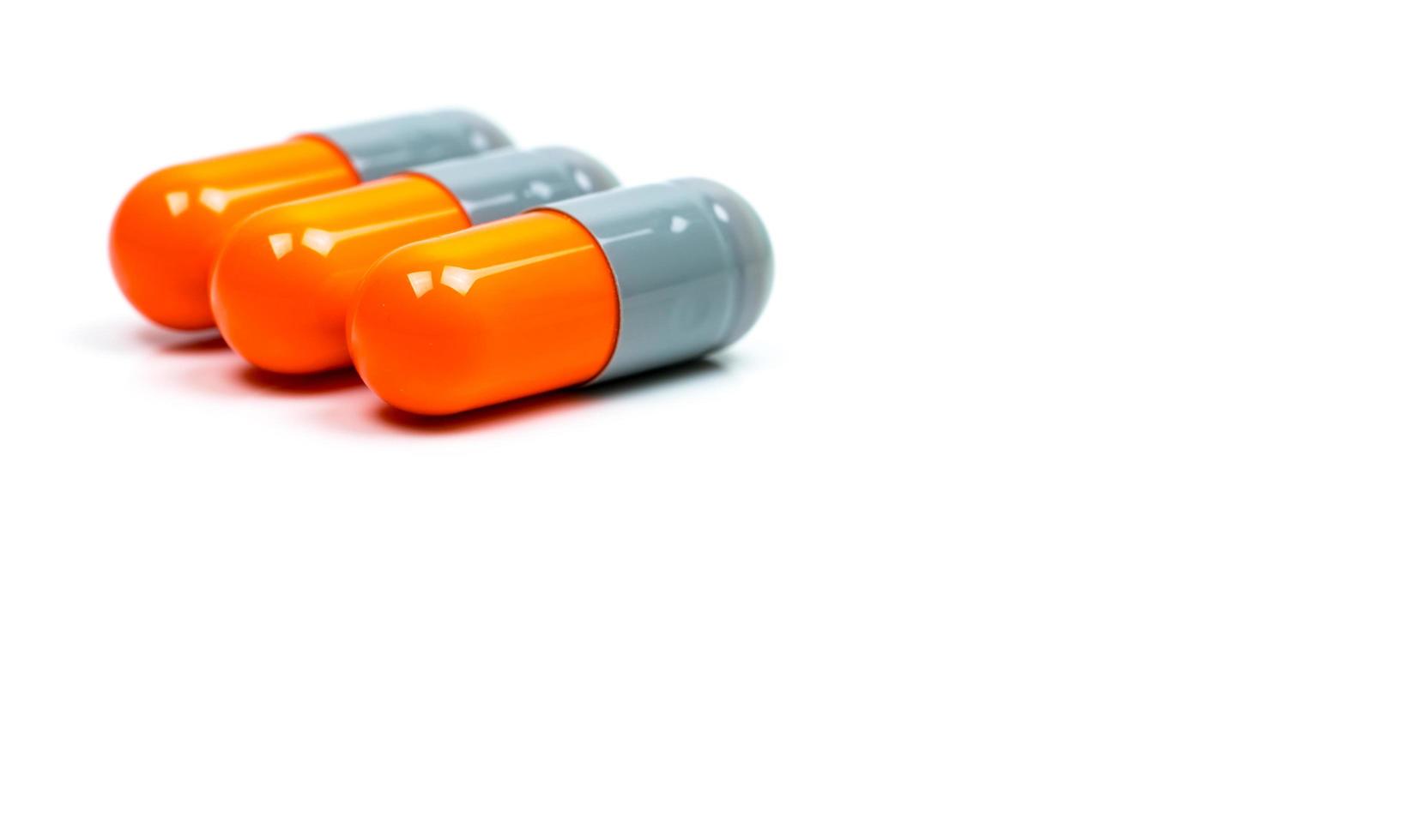 Selective focus of antibiotic capsules pills on blur background with copy space. Drug resistance concept. Antibiotics drug use with reasonable and global healthcare concept. photo