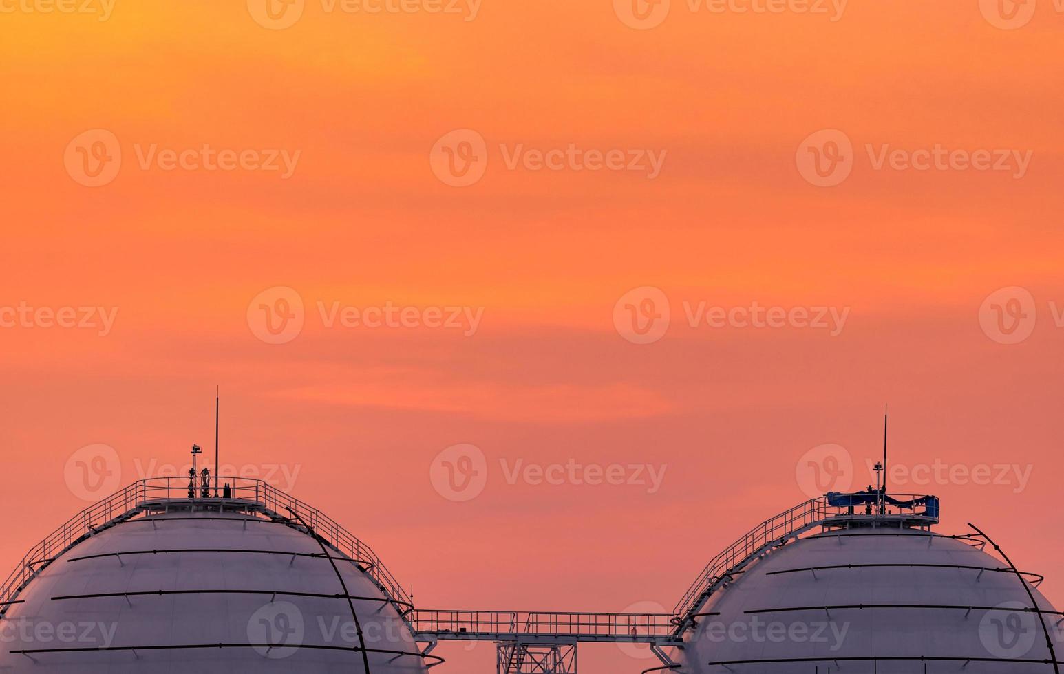 Industrial gas storage tank. LNG or liquefied natural gas storage tank. Spherical gas tank in petroleum refinery. Above-ground storage tank. Natural gas storage industry and global market consumption photo