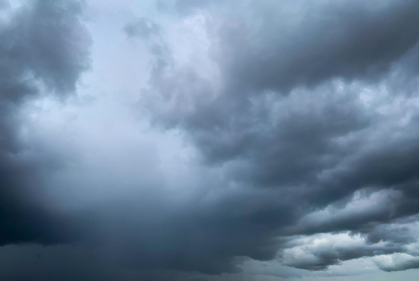 Dark dramatic sky and clouds. Background for death and sad concept. Gray sky and fluffy white clouds. Thunder and storm sky. Sad and moody sky. Nature background. Dead abstract background. Cloudscape. photo