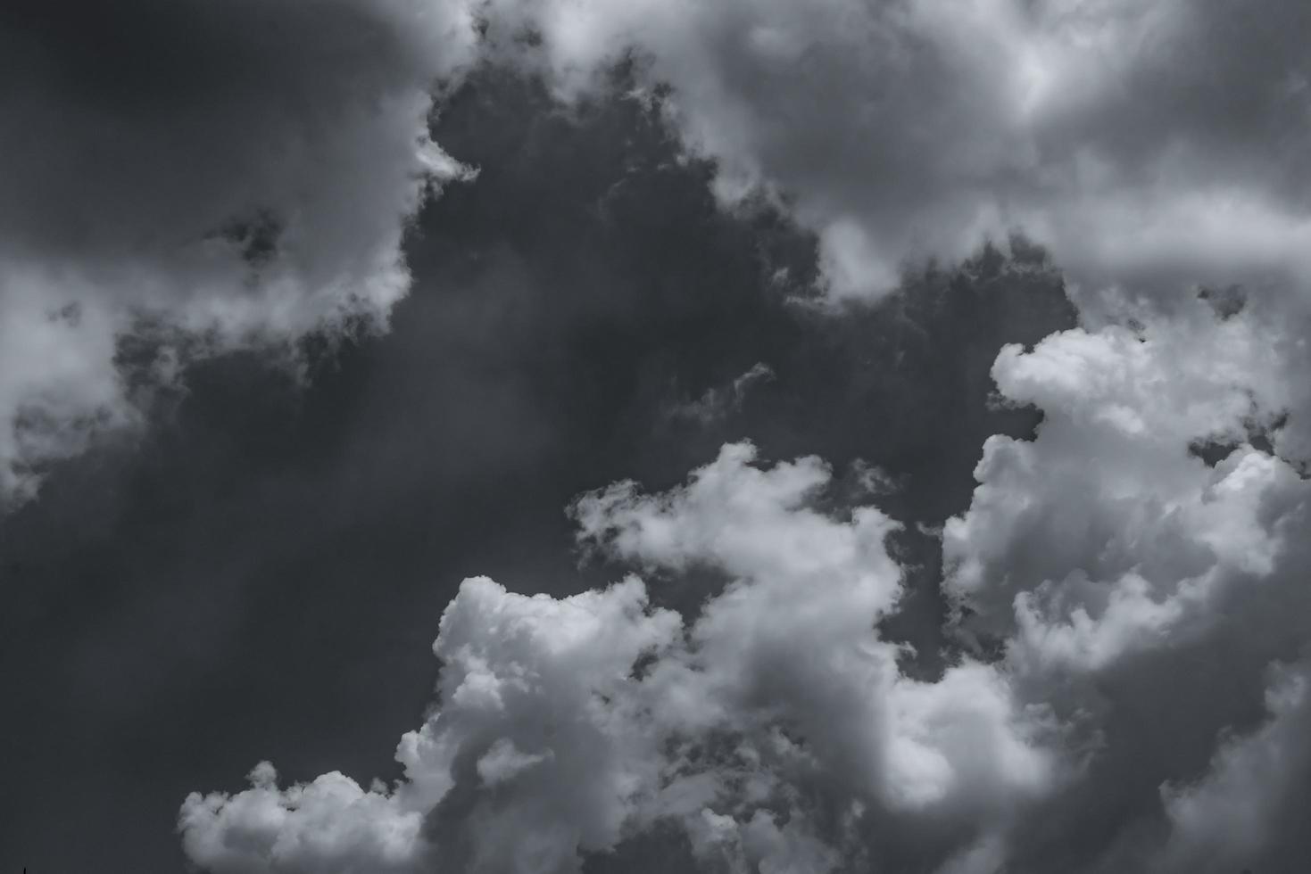 Dark dramatic sky and clouds. Background for death and sad concept. Gray sky and fluffy white clouds. Thunder and storm sky. Sad and moody sky. Nature background. Dead abstract background. Cloudscape. photo