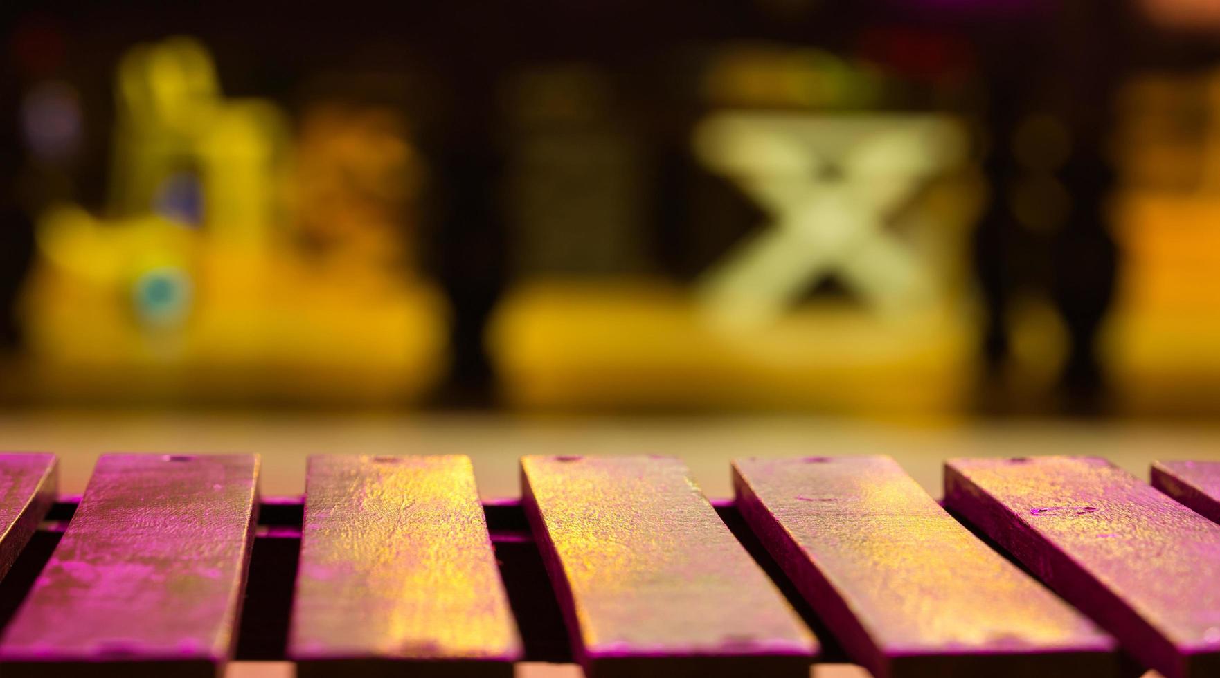 Empty wood bench on blur background with night light. photo