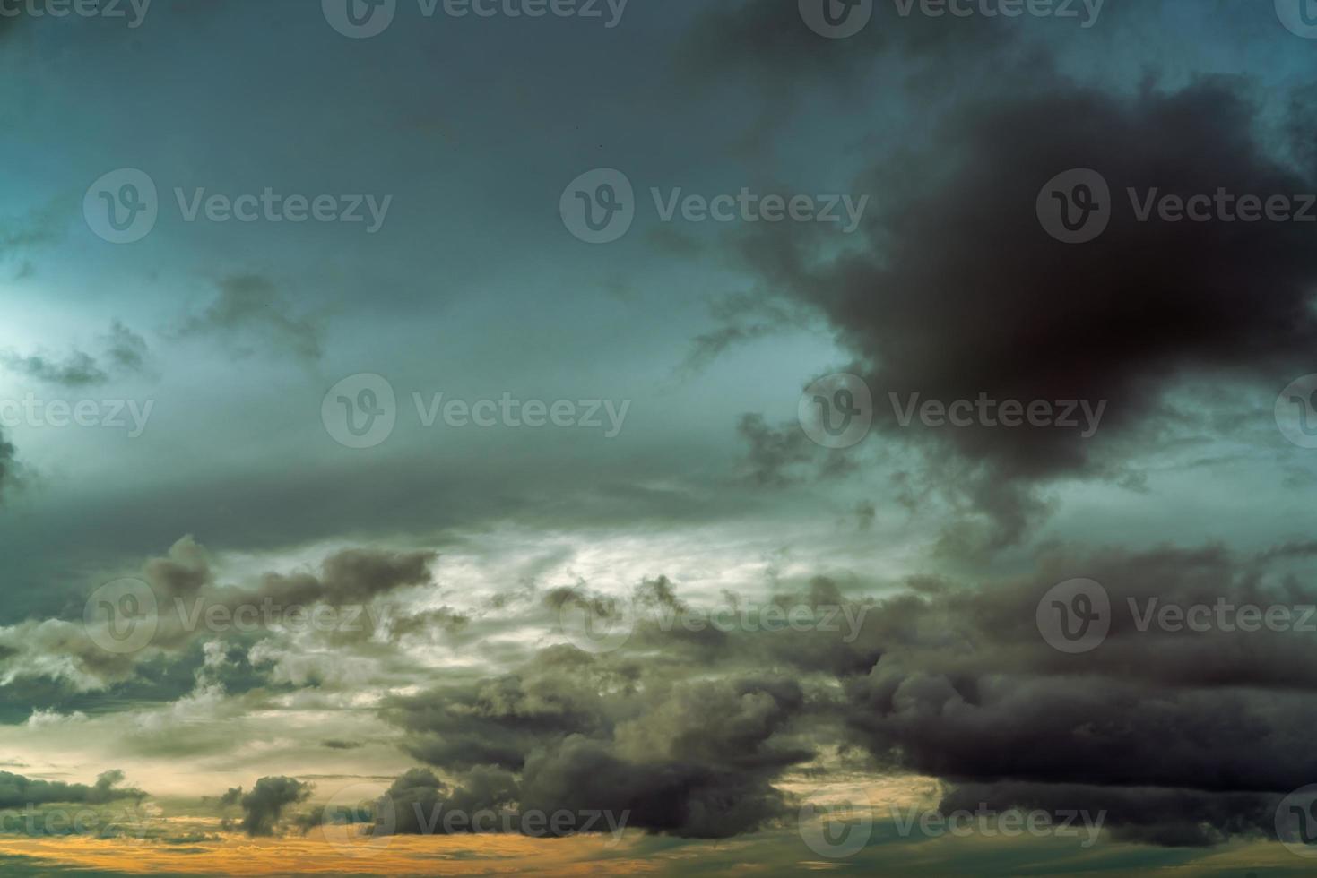 Sunset sky and gray and golden clouds. Gray sky and fluffy clouds. Thunder and storm sky. Sad and moody sky. Dead abstract background. Cloudscape. Peaceful and tranquil background. Beauty in nature. photo