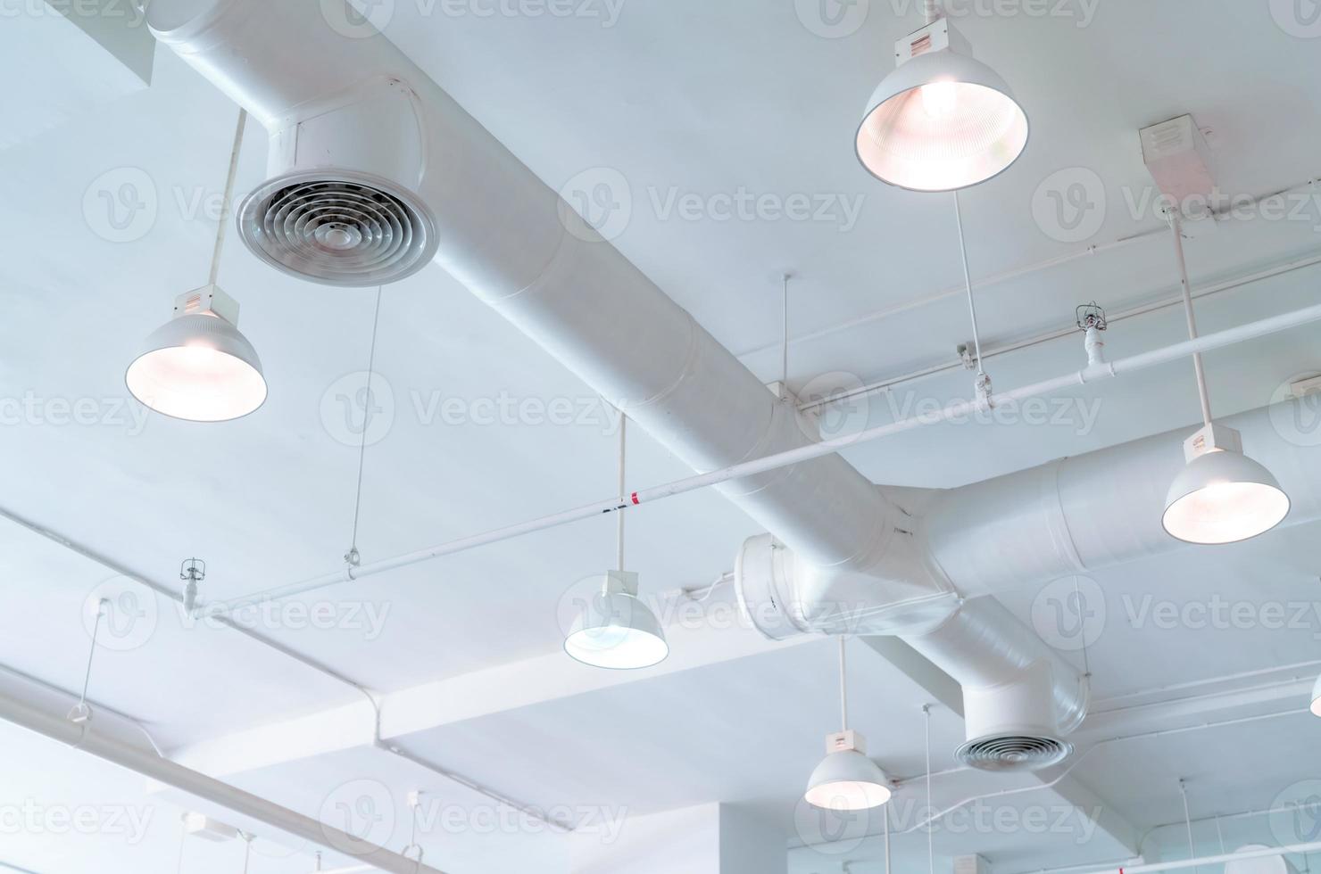 Air duct, automatic fire sprinkler safety system. Fire protection and detector. Fire sprinkler system. Building interior concept. Ceiling lamp light with opened light. Interior architecture concept. photo