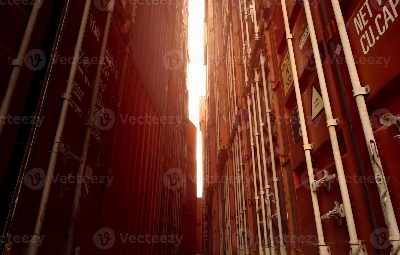 Selective focus on container logistic. Cargo and shipping business. Container ship for import and export logistic. Logistic industry from port to port. Container at harbor for truck transport. photo