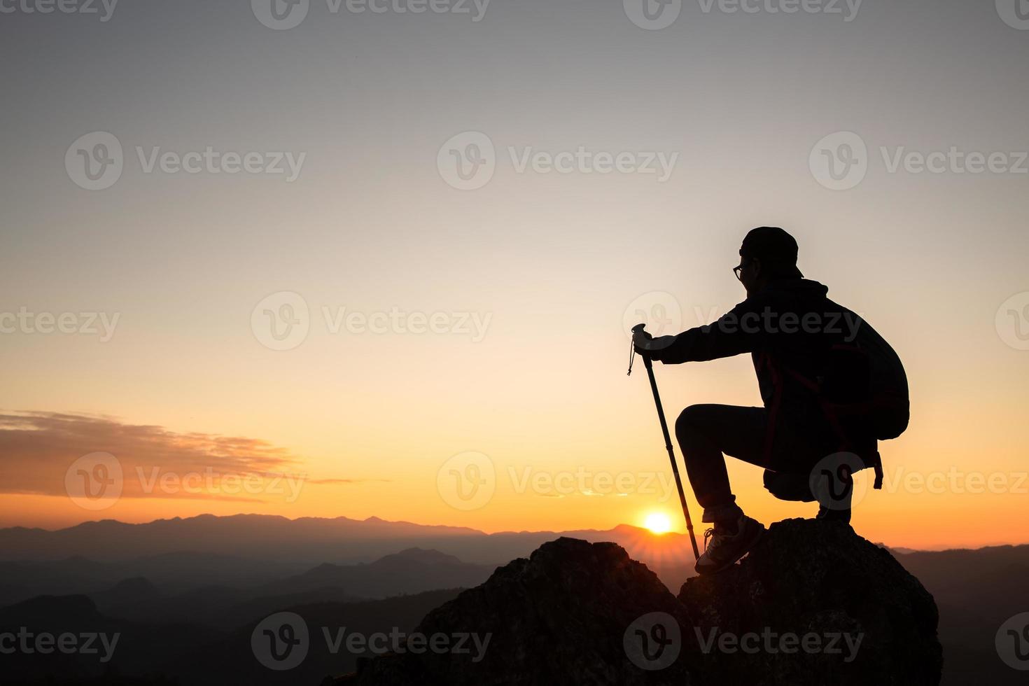 Silhouette woman on mountain successful business leadership, top person winner.Sports business and active life concept,hiking. photo