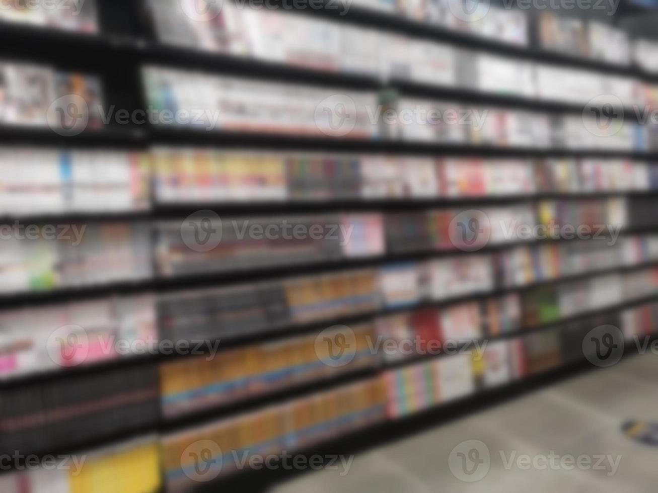 Blurred of Books arranged on shelves, bookshelf in the shop or library, background photo