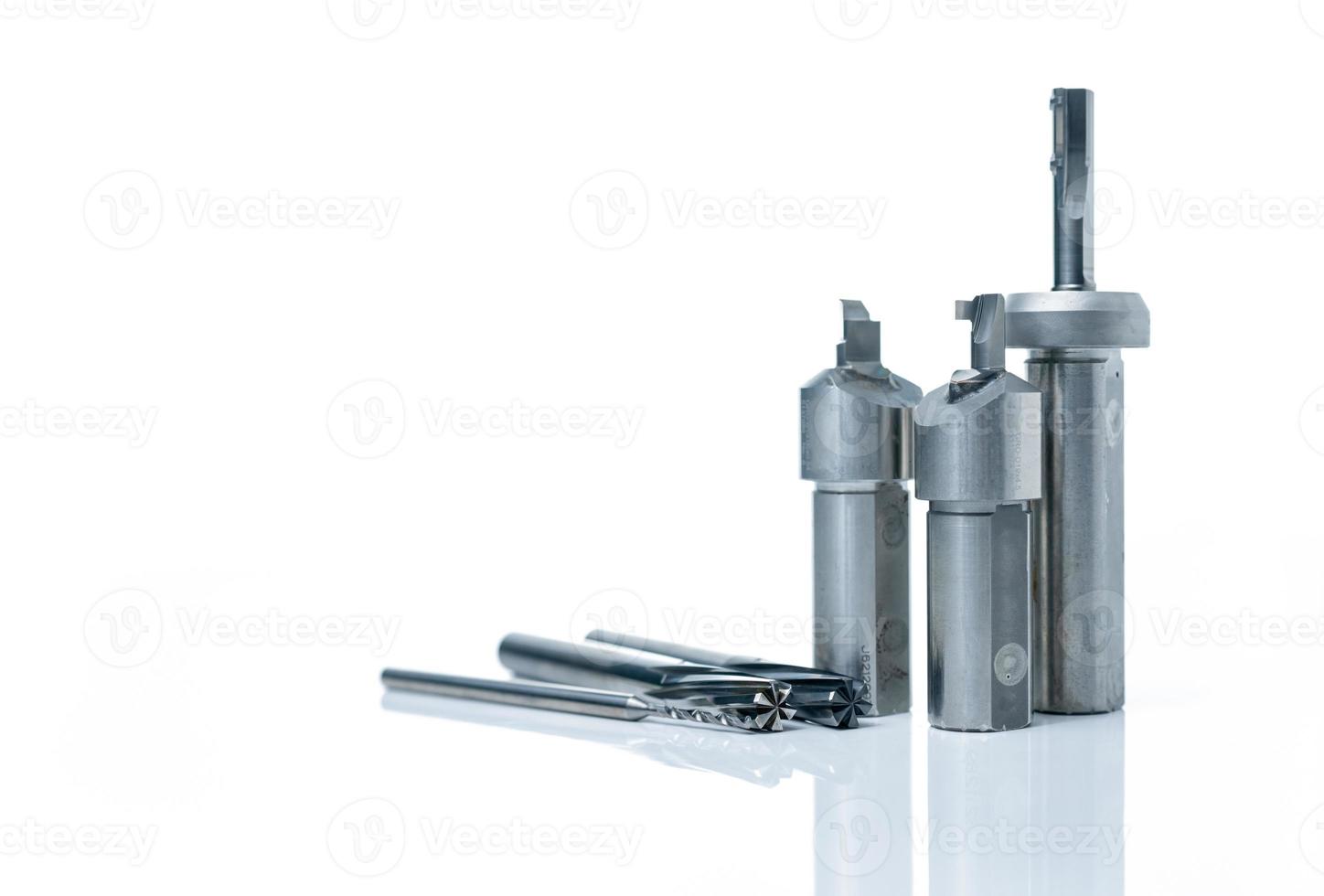 Special tools isolated on white background. Made to order special tools. Coated step drill and reamer detail. HSS cemented carbide. Carbide cutting tool for industrial applications. Engineering tools. photo